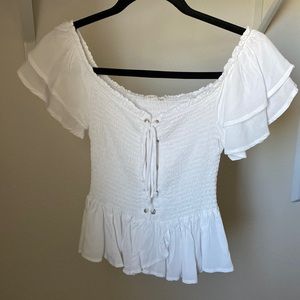 Off shoulder white smocked top